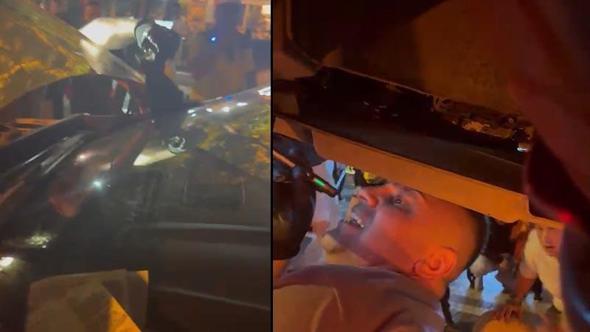 Trafik polisi aracına sıkışan kedi, çekiciyle kurtarıldı