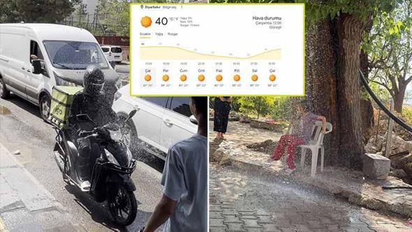 Diyarbakır'da sıcaklık 40 dereceyi aştı, hortumla serinleyenler objektife yansıdı