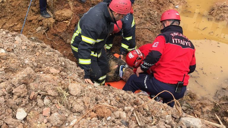 Temel kazısında toprak altında kalan inşaat işçisini itfaiye ve mesai arkadaşları kurtardı