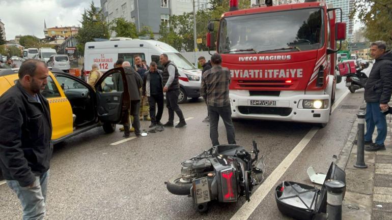 Maltepede hakimiyetini kaybeden motosiklet sürücüsü taksinin altında kaldı