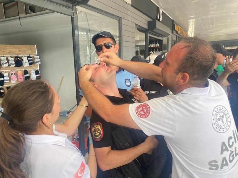 Antalyada kaçak yapıların yıkımında arbede; kendilerini yakmaya çalışıp, iş makinelerinin önüne yattılar