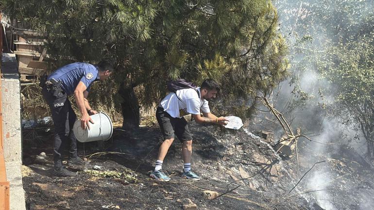 Kağıthanede ağaçlık alanda yangın; polis itfaiye hortumuyla, çevredekiler damacanayla müdahale etti