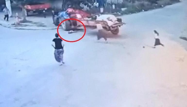 2 yaşındaki Batunun, babasının kullandığı traktörün altında kaldığı anlar kamerada