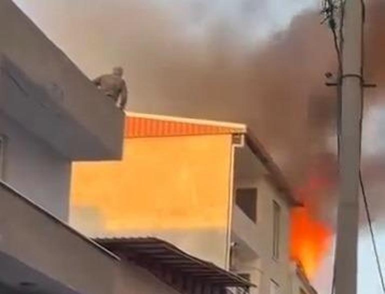 Evde çıkan yangında önce çocuğunu, sonra kendisini 3’üncü kattan attı; o anlar kamerada