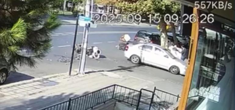 Otomobil ile çarpışan motosiklette 2 kişi yaralandı; kaza kamerada