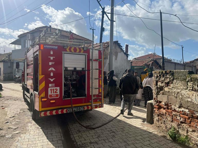 Aydında evde çıkan yangında kadını komşuları kurtardı