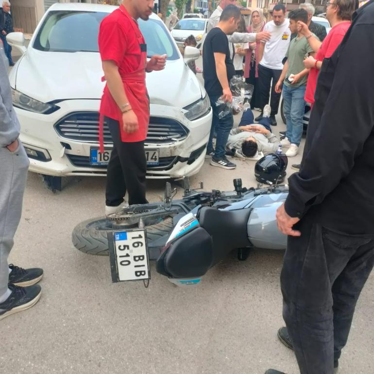 Bursada otomobil ile çarpışan motosiklet sürücüsü yaralandı; kaza kamerada