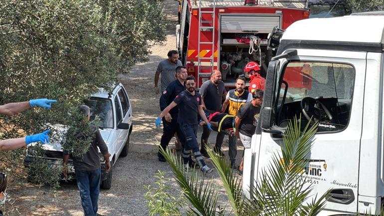 Bodrumda iş makinesi taşıyan kamyon devrildi: 3 yaralı
