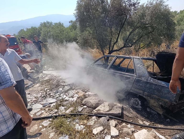 Yanan otomobilini uzaklaştırıp, alevlerin ormana sıçramasını önledi