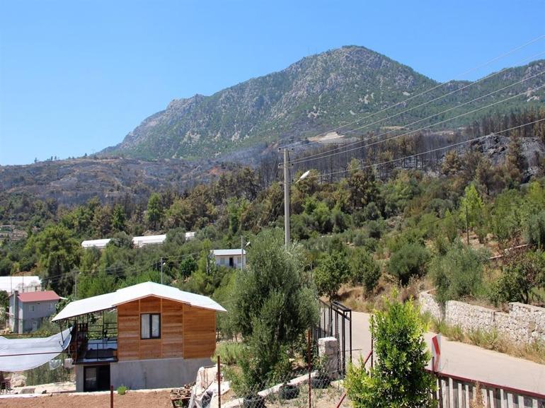 Emekli itfaiyeci evini yanmaktan kurtardı