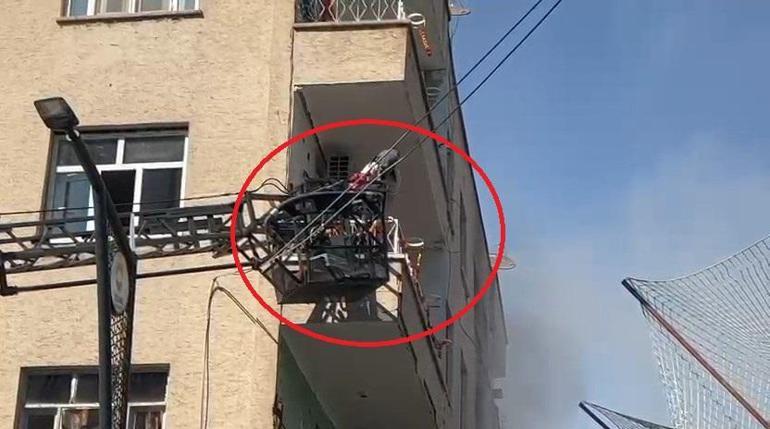 Yangında mahsur kalan kadını konteynerin üzerine çıkarak kurtardılar